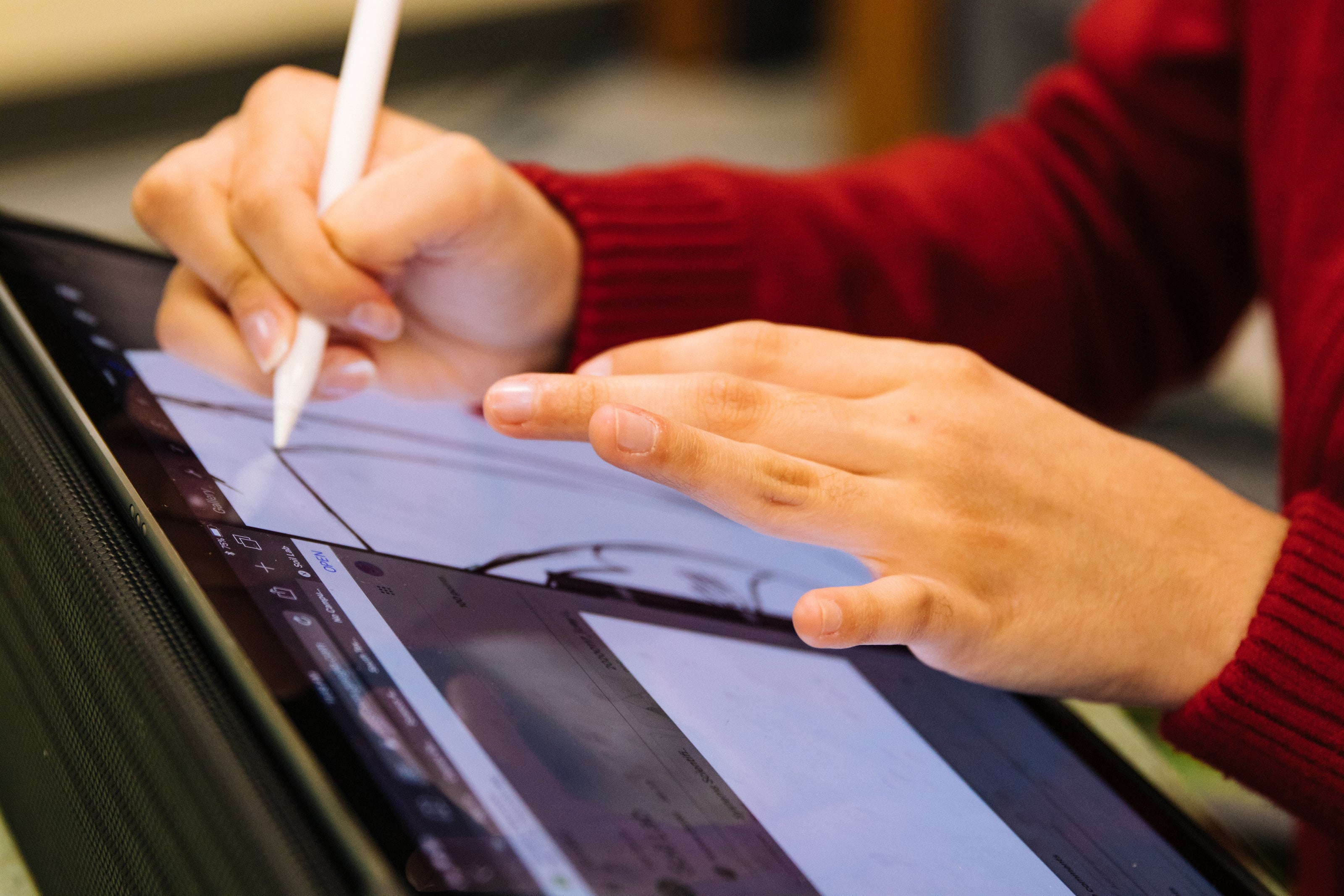 person-using-pencil-to-design-on-tablet